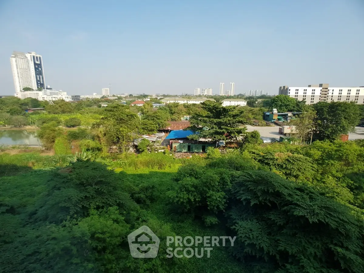 Scenic view of lush greenery with urban skyline in the background, perfect for nature lovers seeking city proximity.