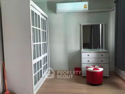 Spacious bedroom with modern wardrobe and stylish vanity set