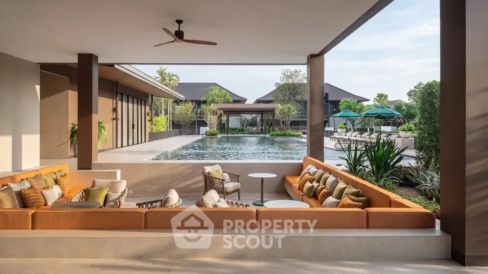 Luxurious outdoor lounge with pool view in modern villa setting