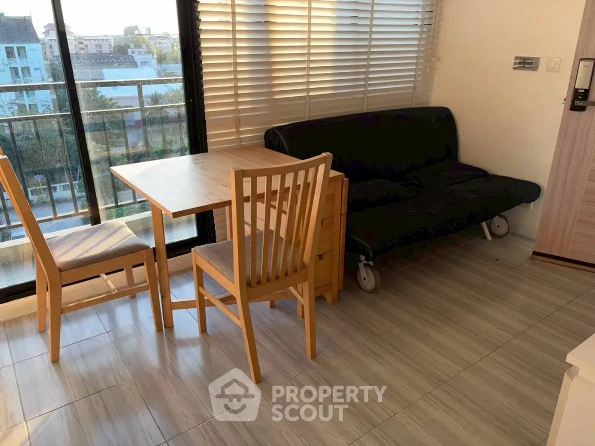 Cozy living room with wooden furniture and balcony view