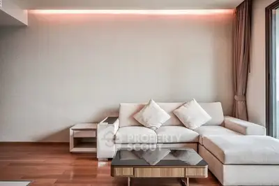Modern living room with stylish sofa and elegant wooden flooring
