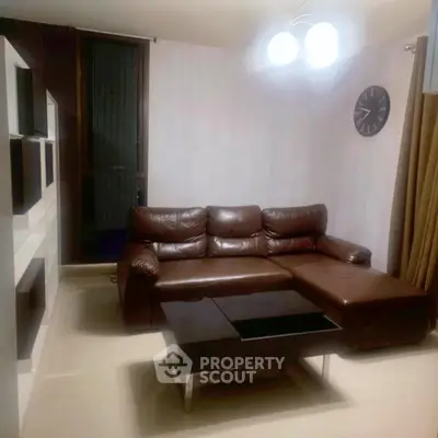 Modern living room with leather sofa and stylish decor