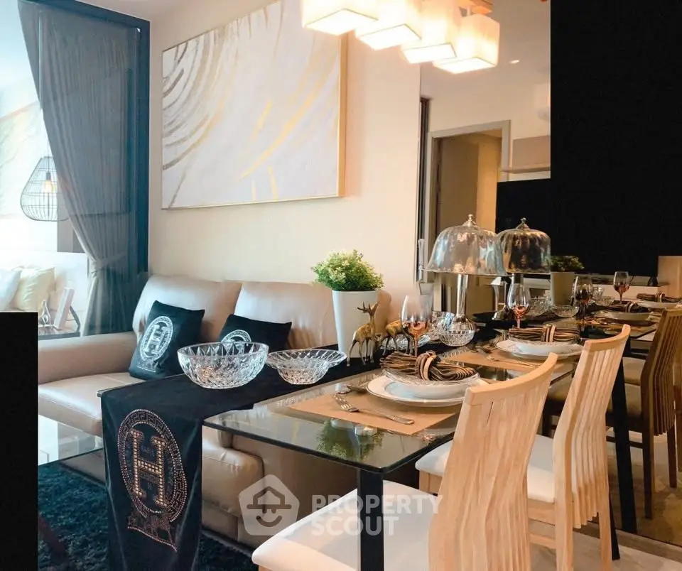 Luxurious dining and living area with elegant decor and modern furniture in a stylish apartment.