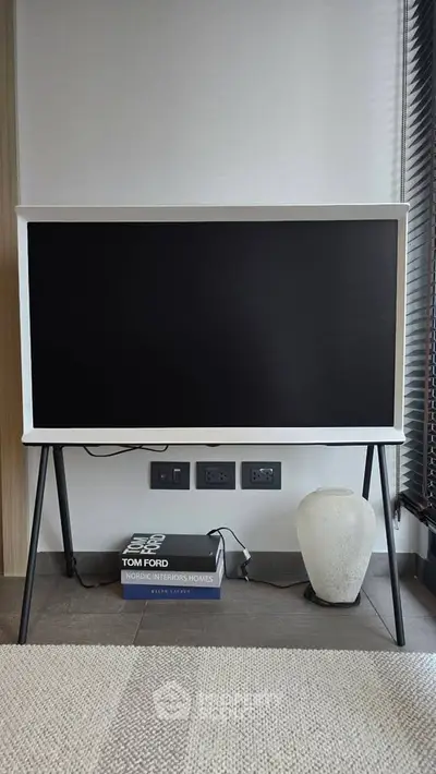 Modern interior with stylish TV stand and decor in a contemporary living room setting.