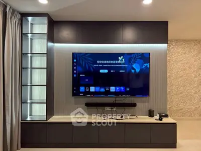 Modern living room with sleek entertainment center and wall-mounted TV, perfect for cozy movie nights.