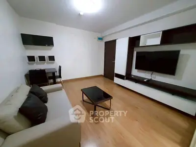 Modern living room with sleek furniture and wooden flooring