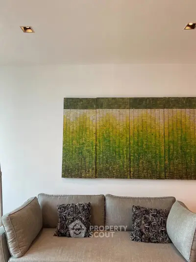 Modern living room with stylish sofa and abstract wall art