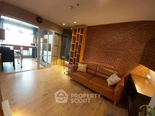 Stylish living room with brick accent wall and modern furnishings