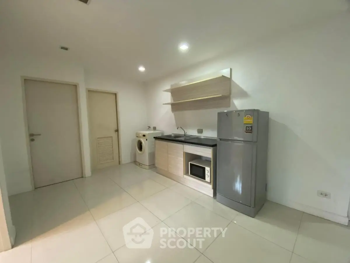 Modern kitchen with sleek appliances and minimalist design