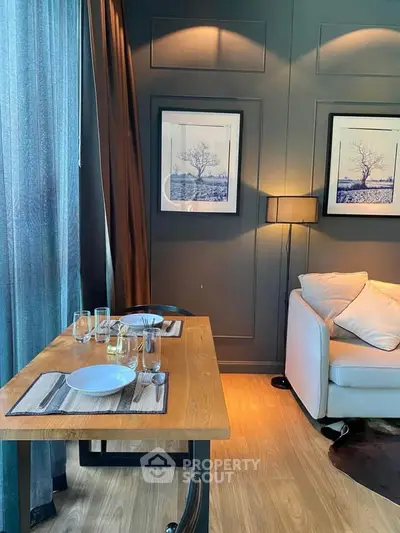 Stylish living room with elegant dining setup and cozy sofa