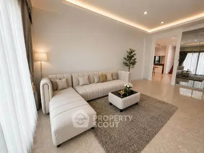 Spacious modern living room with elegant L-shaped sofa and stylish decor