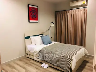 Cozy bedroom with modern decor and air conditioning, perfect for restful nights.