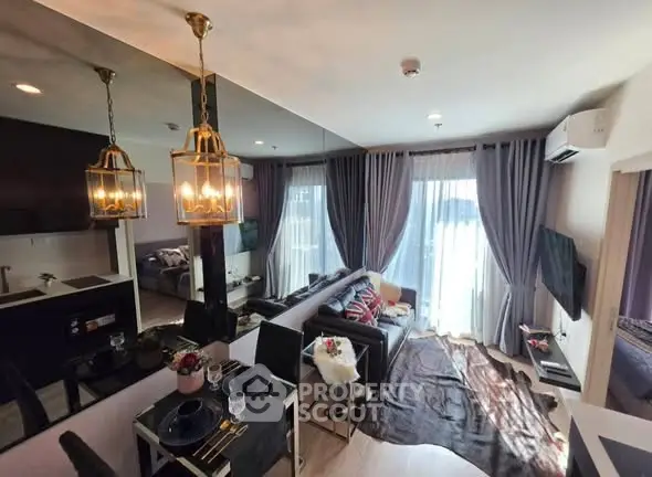 Modern living room with elegant decor, large windows, and stylish lighting in a contemporary apartment.