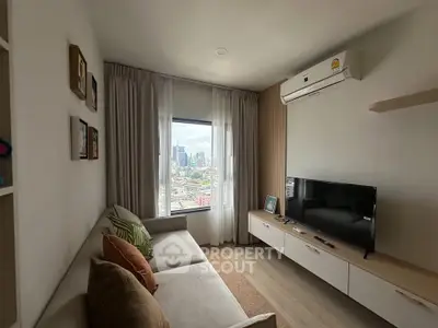 Modern living room with city view, cozy sofa, and sleek entertainment unit.
