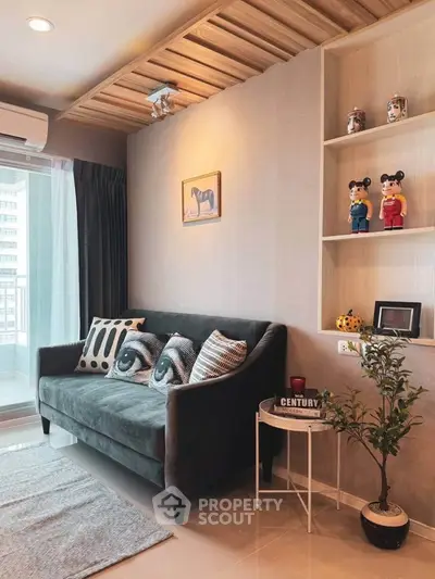 Stylish living room with modern decor and cozy sofa in a high-rise apartment.