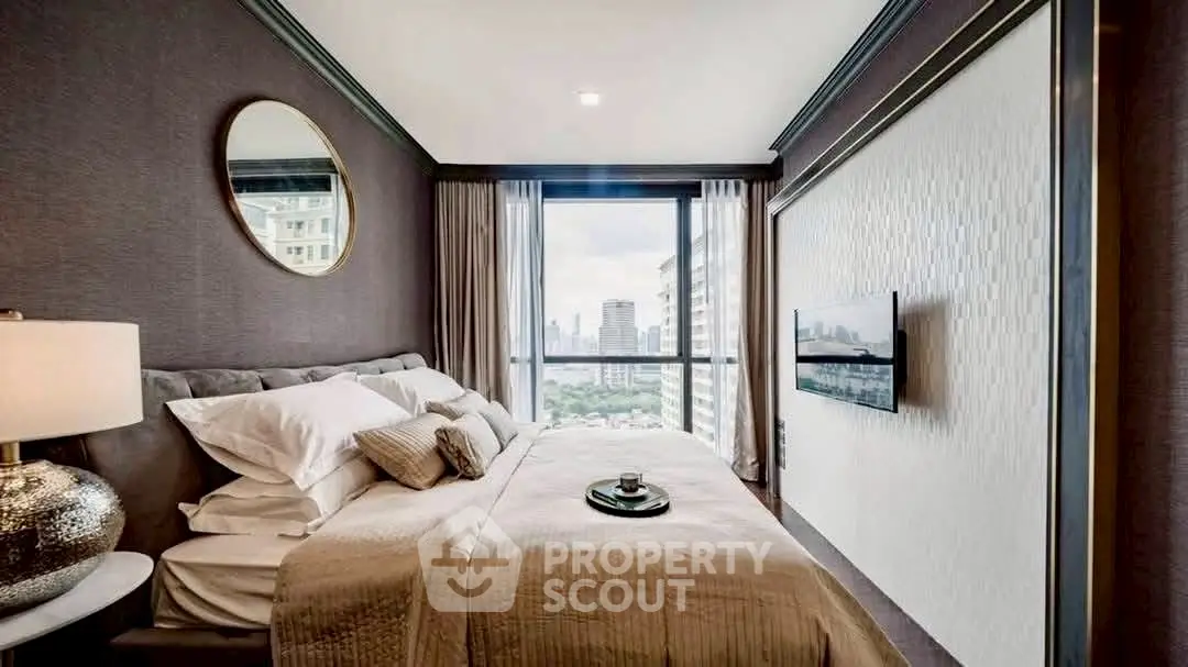 Luxurious bedroom with city view, elegant decor, and modern amenities.