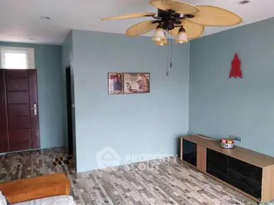 Modern living room with stylish ceiling fan and contemporary decor
