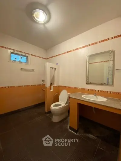Spacious bathroom with modern fixtures and stylish tile design