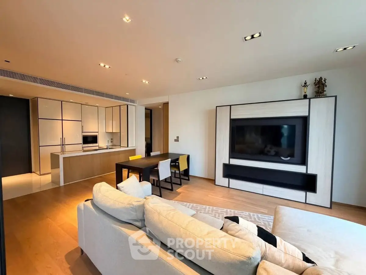 Spacious modern living room with open kitchen and elegant decor