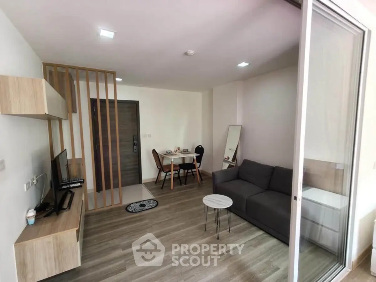 Modern living room with sleek furniture and open layout, perfect for cozy gatherings.