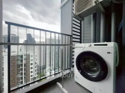 Modern balcony with washing machine and city view, perfect for urban living.