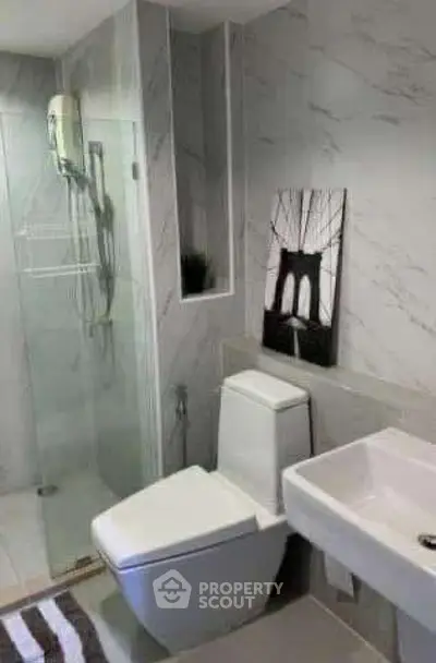 Modern bathroom with sleek design and glass shower enclosure