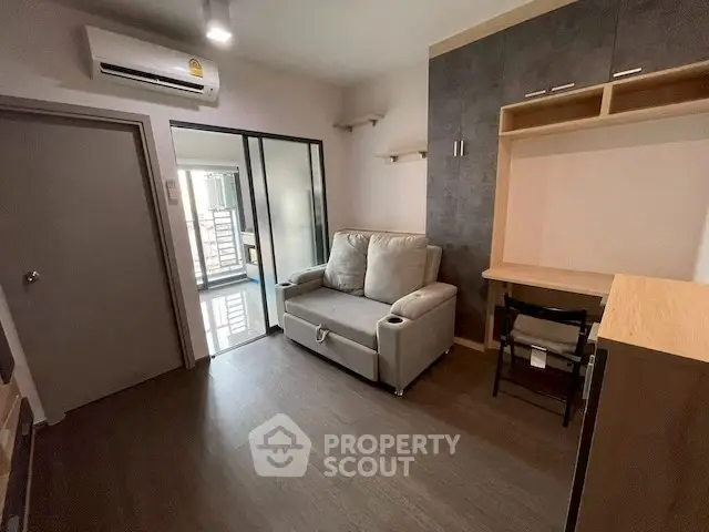 Modern living room with sleek furniture and air conditioning in a cozy apartment.