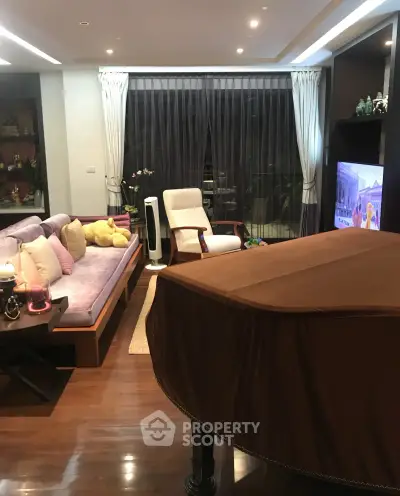 Luxurious living room with elegant decor and grand piano, perfect for entertaining guests.