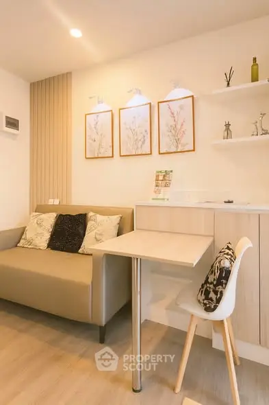 Cozy living room with modern decor and stylish furniture in a well-lit apartment.