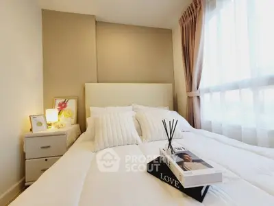 Cozy and bright bedroom with elegant decor and large window for natural light.