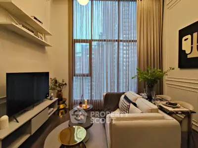 Stylish modern living room with tall windows and elegant decor