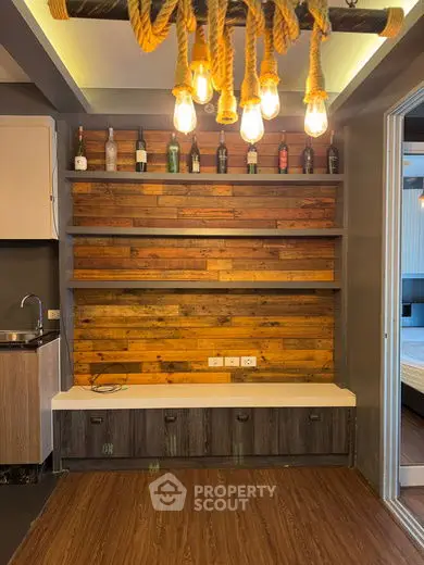 Stylish interior with rustic wooden shelves and modern lighting in a cozy living space.