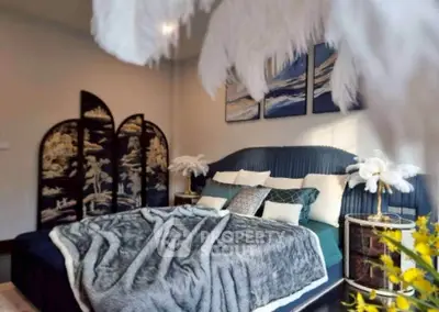 Luxurious bedroom with elegant decor and plush bedding in a stylish home.