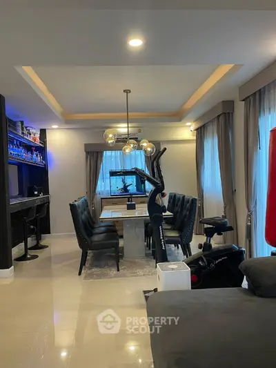 Modern living room with glossy tiled flooring, elegant lighting, and a mix of classic and contemporary furnishings, perfect for urban living.