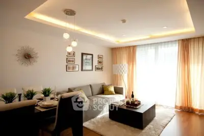 Stylish modern living room with elegant decor and ample natural light.