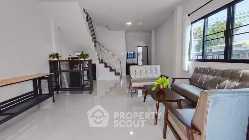 Spacious modern living room with sleek furniture and natural light