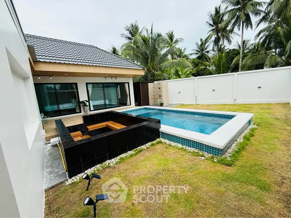 Luxurious villa with private pool and lush garden, perfect for tropical living.