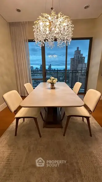Elegant dining area with city view and modern chandelier