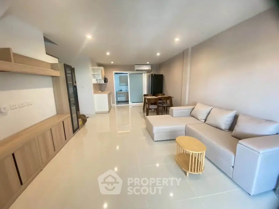 Spacious modern living room with sleek furniture and open layout