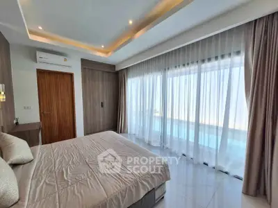 Luxurious bedroom with floor-to-ceiling windows and elegant decor