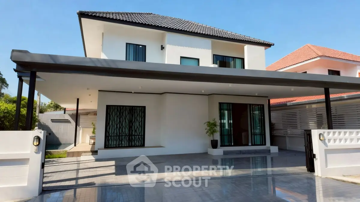 Modern two-story house with sleek design and spacious driveway