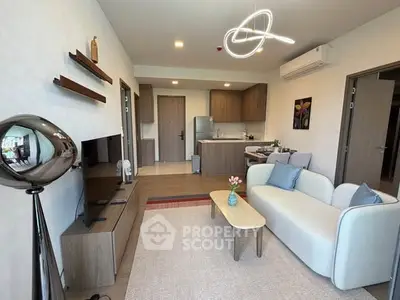 Modern living room with stylish decor and open kitchen layout