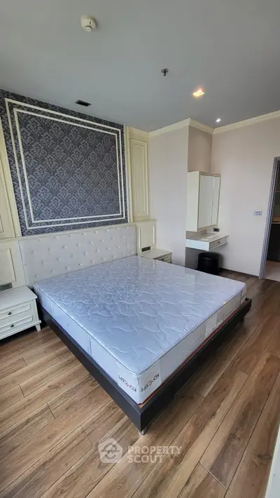 Luxurious bedroom with elegant decor and wooden flooring