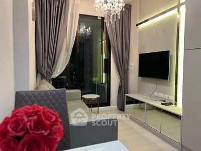 Luxurious modern living room with elegant chandelier and sleek decor