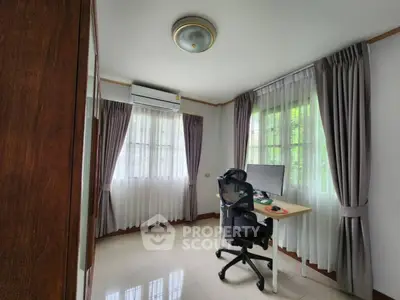 Bright study room with modern desk and ergonomic chair, ideal for productivity.