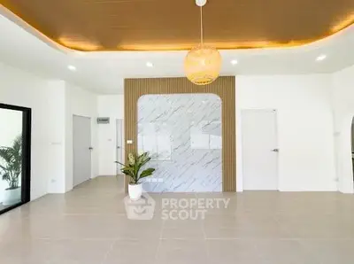 Spacious modern living room with elegant lighting and stylish decor