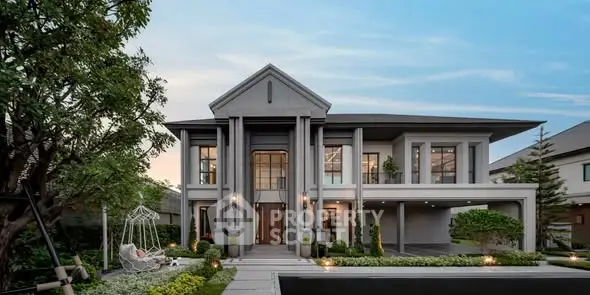 Luxurious modern two-story house with elegant facade and lush landscaping