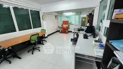 Spacious office interior with modern furniture and ample natural light