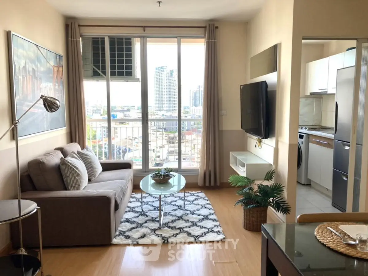 Modern living room with city view, stylish decor, and open kitchen layout in urban apartment.