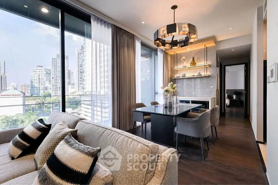 Luxurious modern living room with city view, elegant decor, and spacious dining area in high-rise apartment.